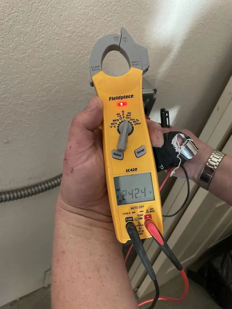 Voltage testing with clamp meter during Outlet Installation in Glenn Dale